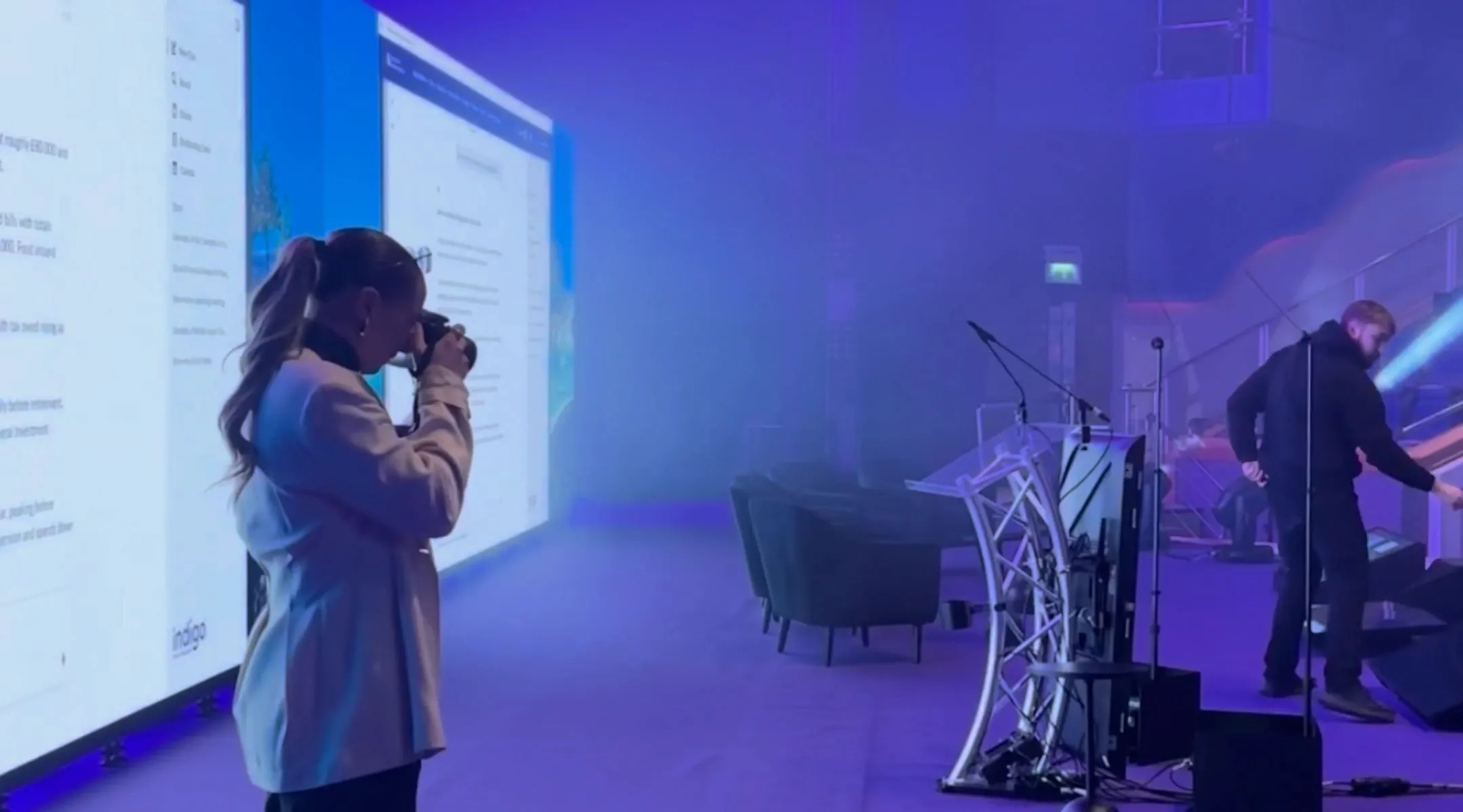 Rose McLean photographing at a live corporate event
